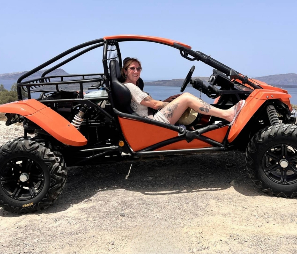 ATV adventure along Santorini coastal road with sea views